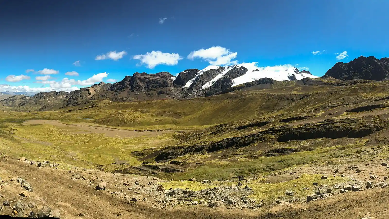High Andean valley and the glaciers of the Ausangate range on the way to Rainbow Mountain