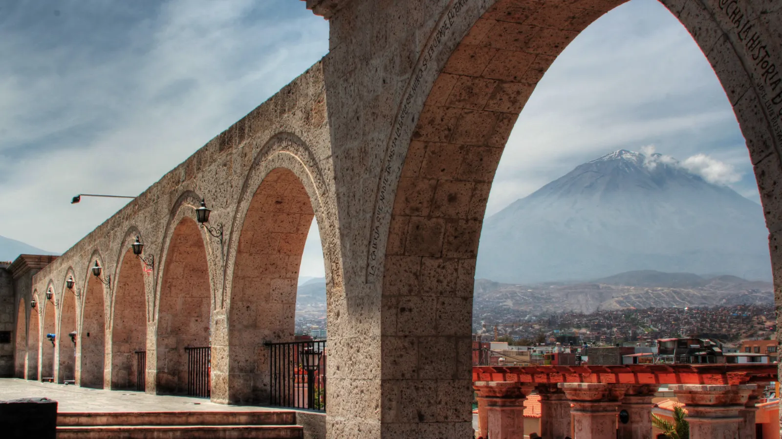 Sillar arches of the Yanahuara viewpoint in Arequipa with El Misti in the distance